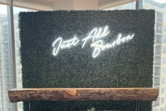 Greenery accent wall for a styled reception